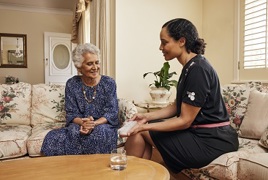 Nurse and client in client's home Nurse and client in client's home