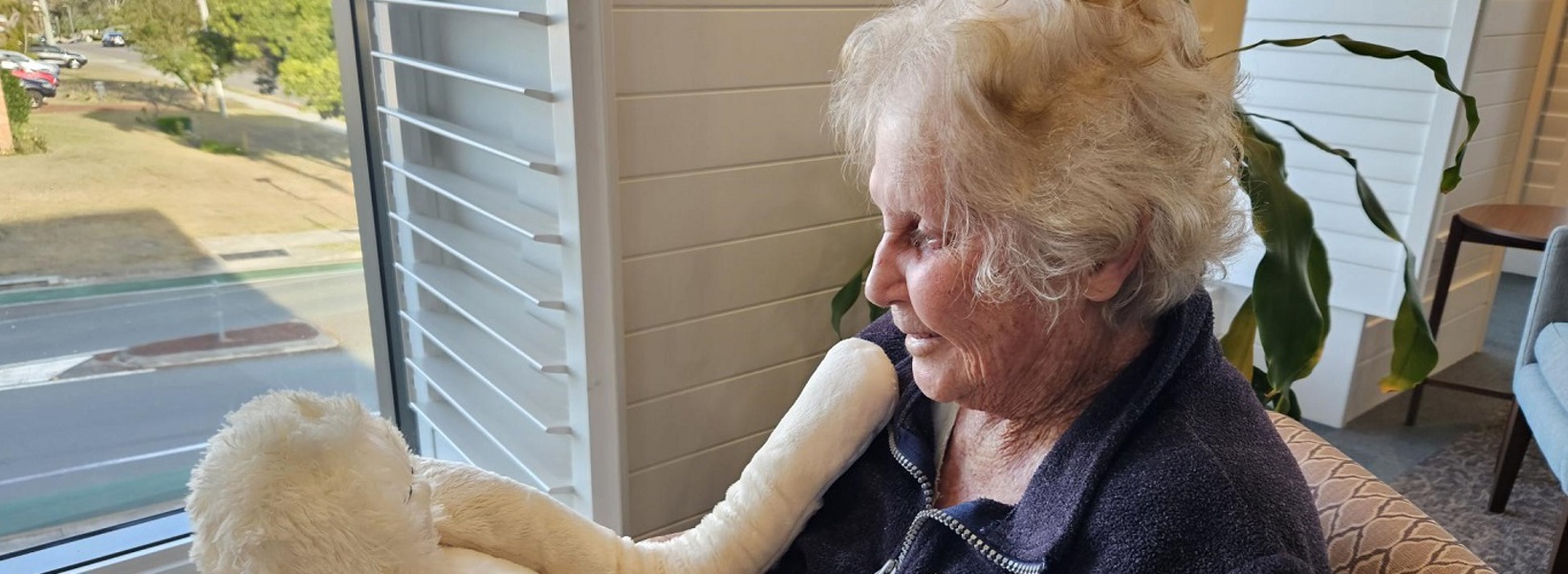 Seaton Place resident with cuddly companion HUG Seaton Place resident with cuddly companion HUG