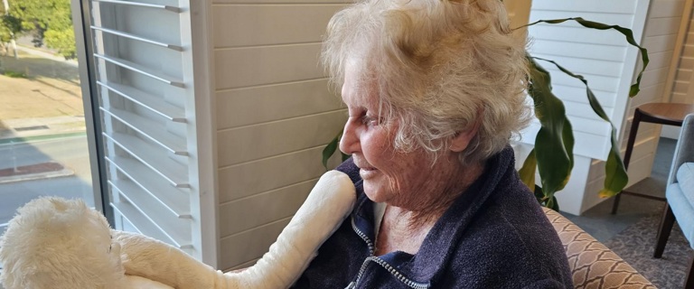 Seaton Place resident with cuddly companion HUG