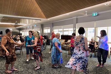 A group of retirement village residents dancing