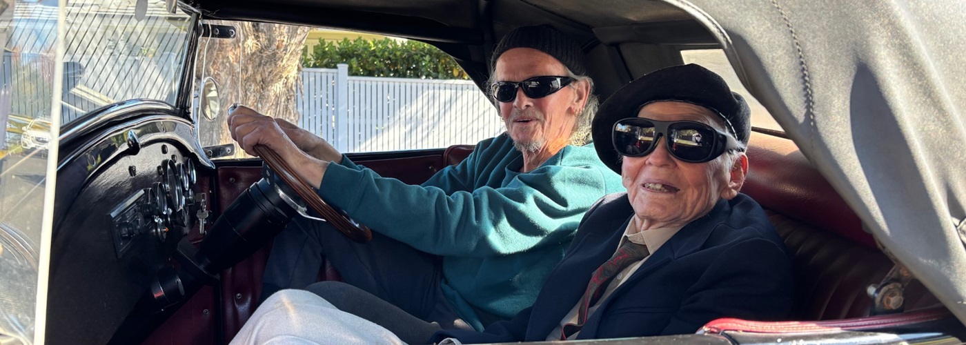 James going for a ride in a hot rod with owner Bruce.jpg
